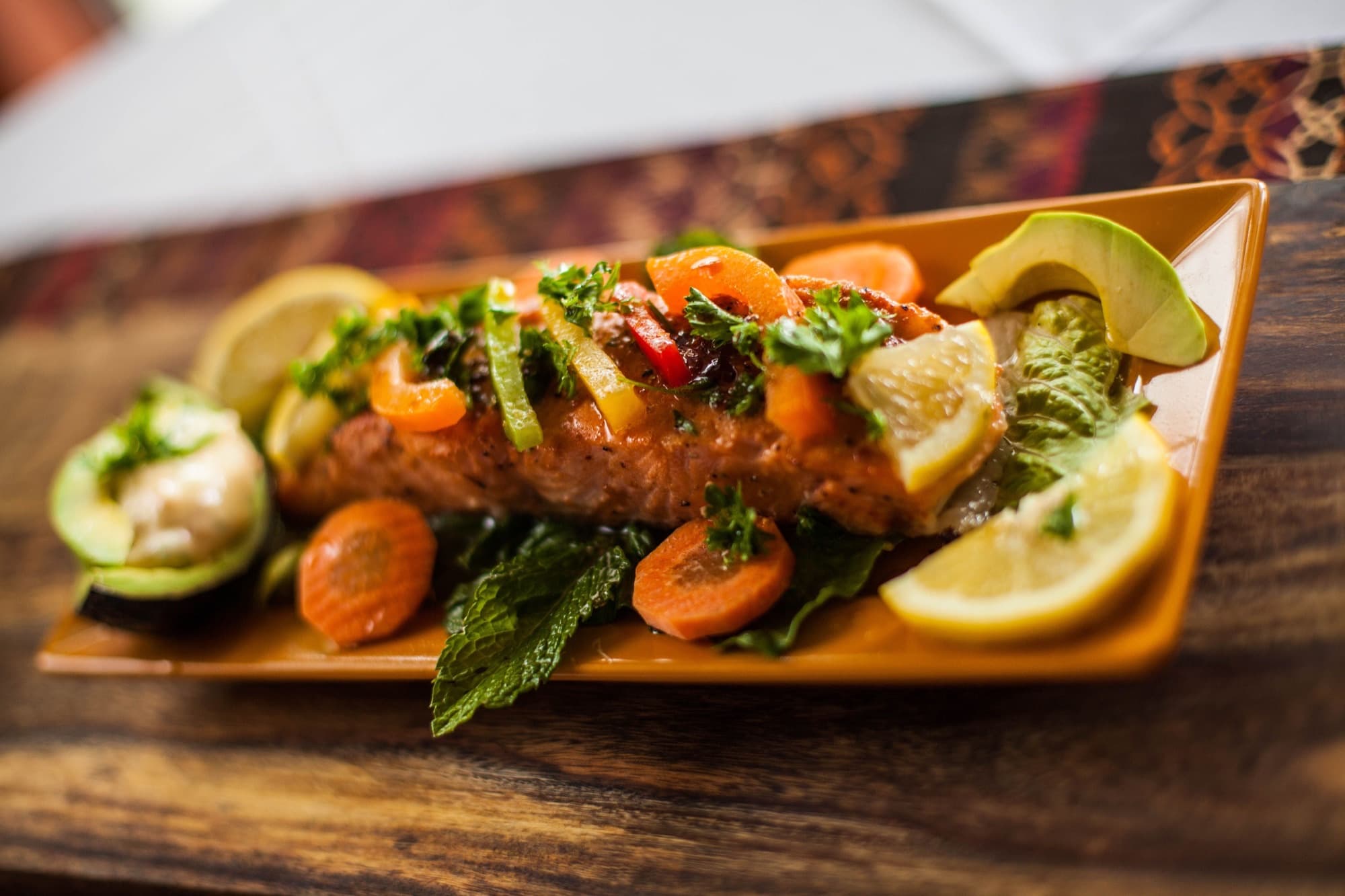 Grilled salmon fillet with vegetables and citrus