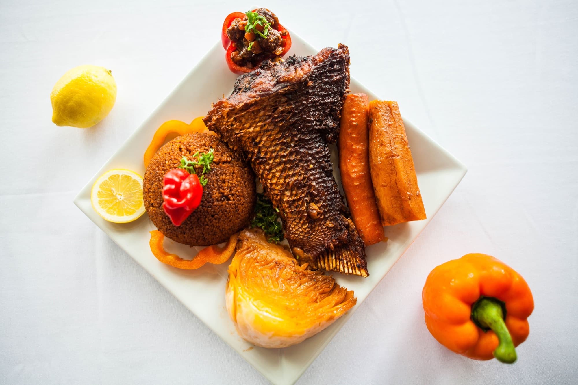 Thiebou djeun — whole fried red snapper with vegetables and plantain