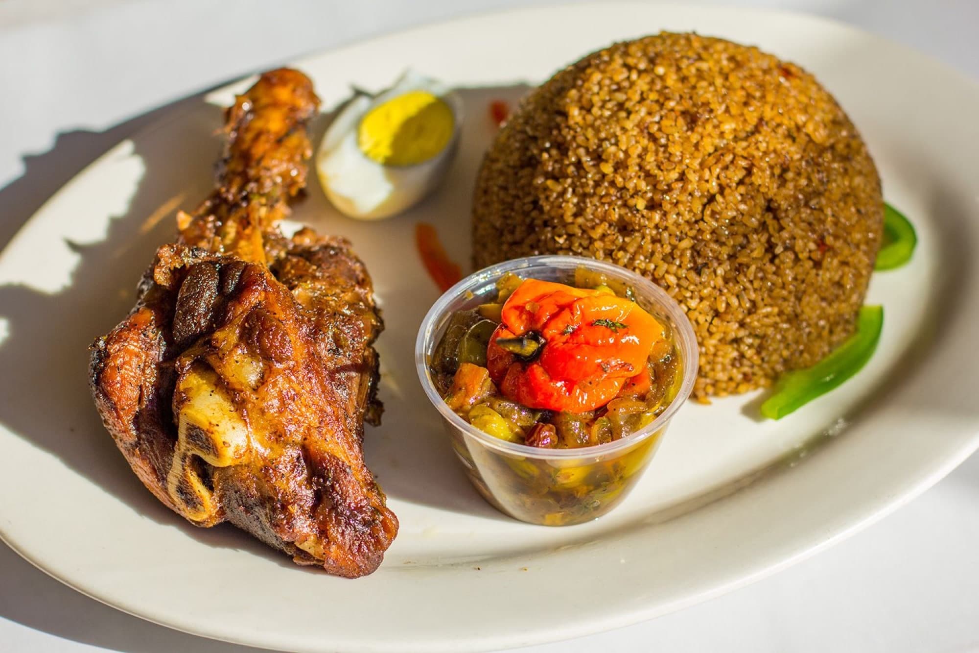 Thiebou yape — lamb with brown jollof rice